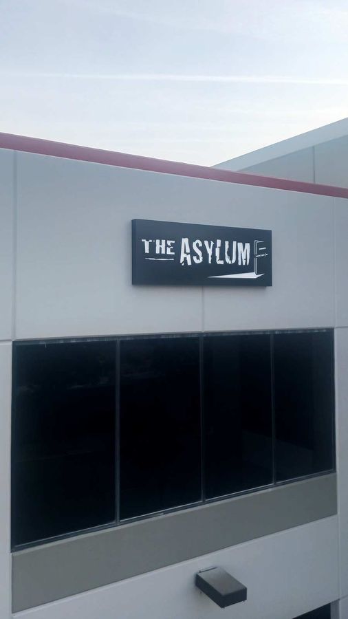 The Asylum light box sign installed on the building