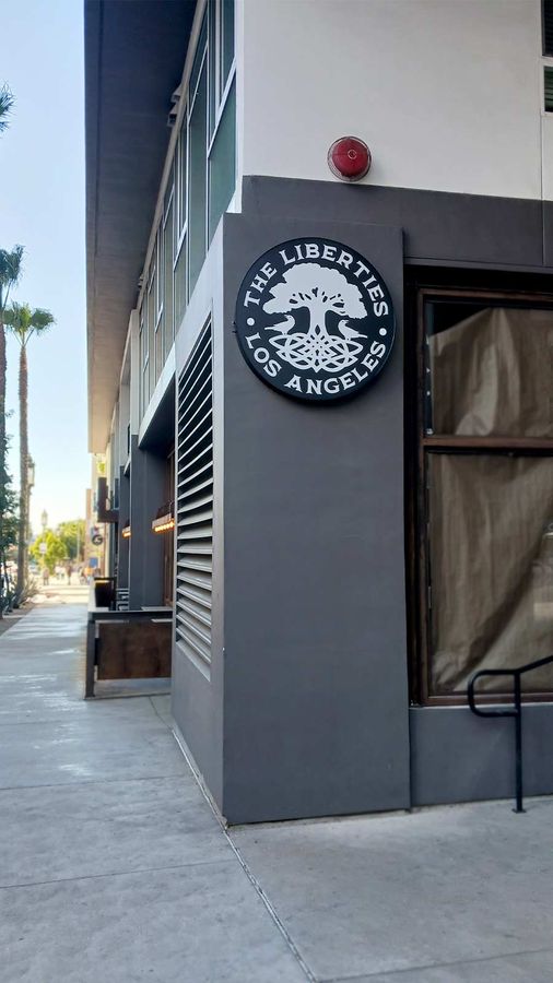 The Liberties building sign attached to the wall