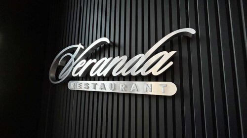 Veranda restaurant sign attached to the wall
