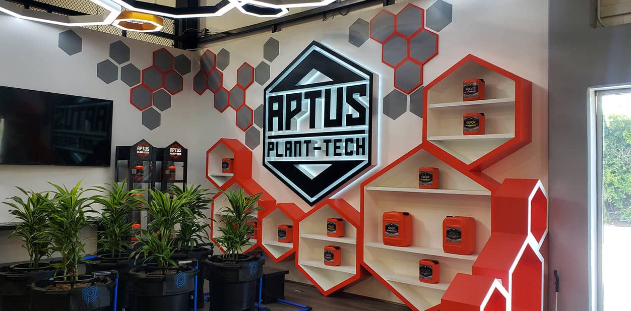 Aptus Plant-Tech modern LED wall art with red and black geometric solutions and branded display