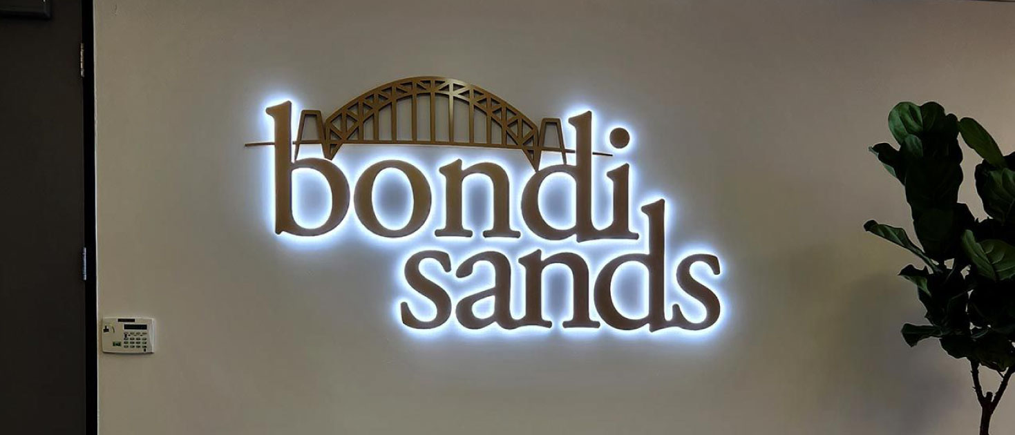 Bondi Sands modern signage with decorative elements and lighting made of aluminum and lexan