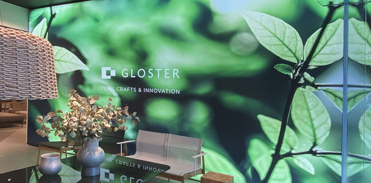 Gloster large illuminated glass wall art depicting the company's slogan with a natural background