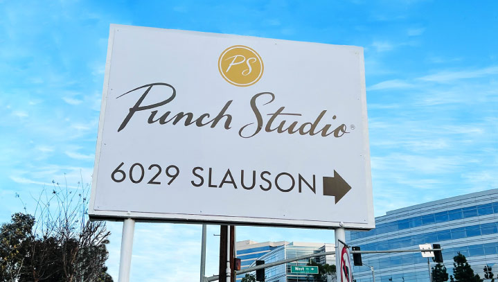 Punch Studio modern business sign with a navigational arrow made of lexan and backlit vinyl