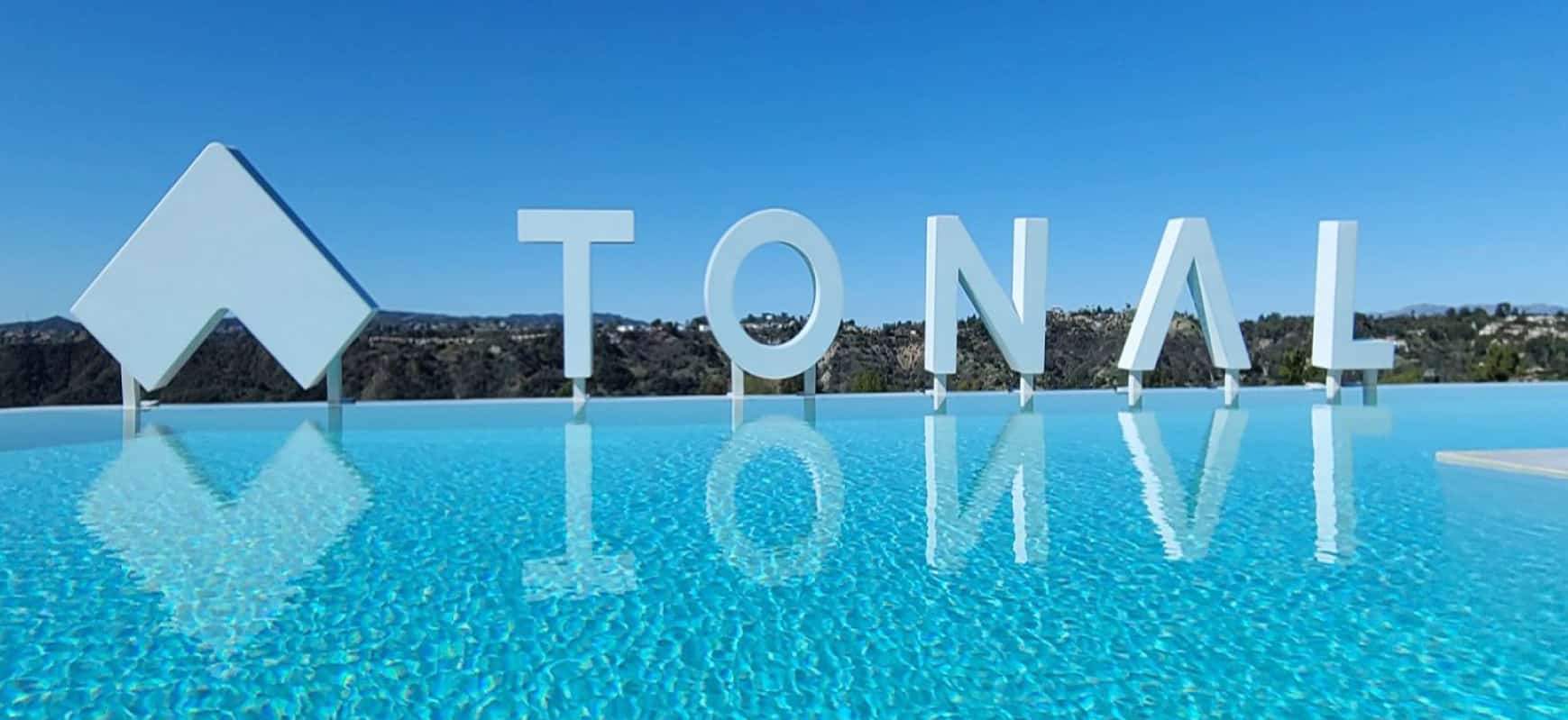Tonal modern signage in a free-standing style made of acrylic and aluminum for pool branding