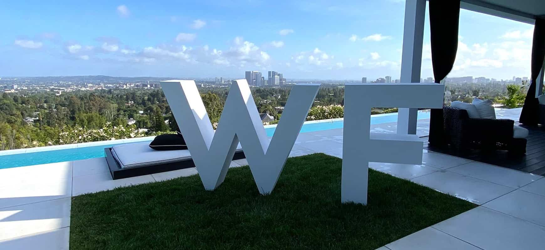 White Fox contemporary sign in white displaying the company logo made of aluminum for branding