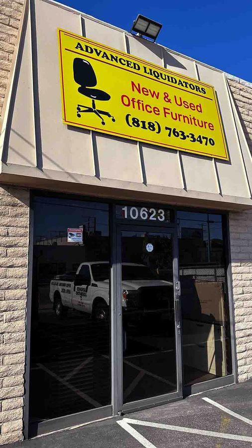 Advanced Liquidators outdoor sign fixed to the building