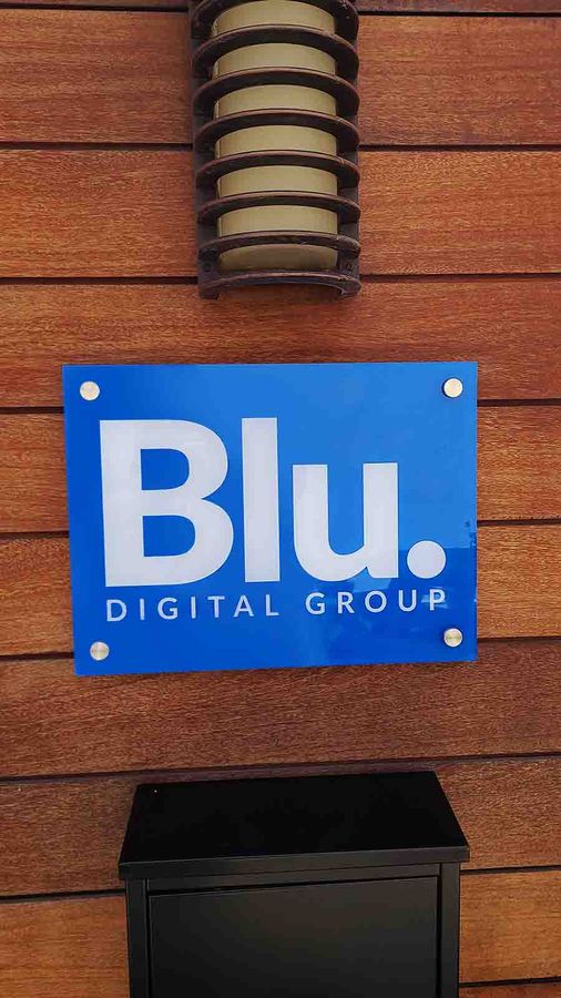 Blu Digital Group logo sign mounted on the wall