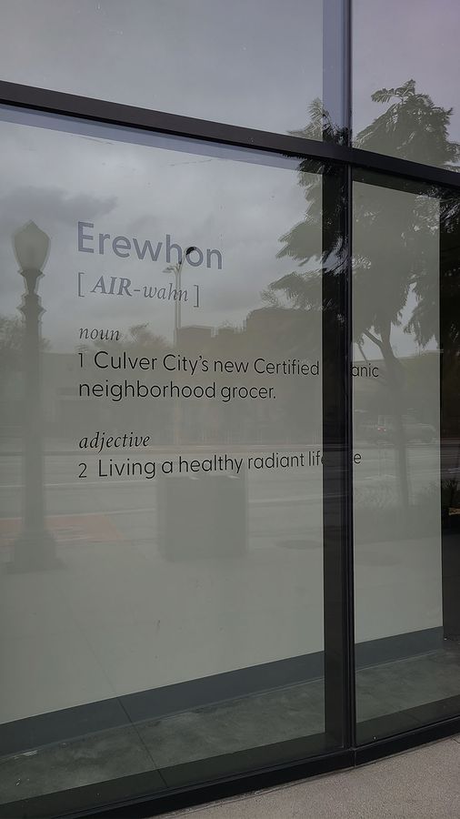 Erewhon store sign attached to the window