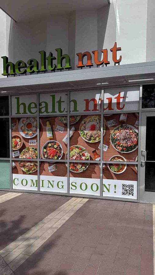 Health Nut store signs installed at the storefront