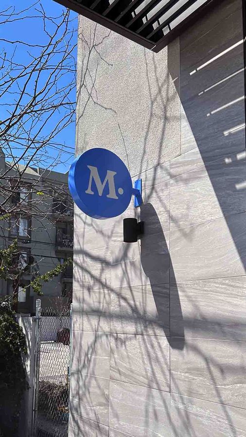 Modern Animal aluminum sign fixed to the exterior wall