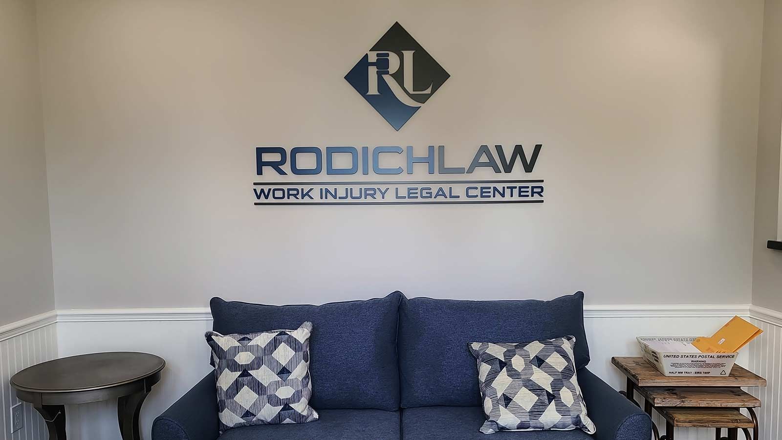 Rodich Law logo sign attached to the wall