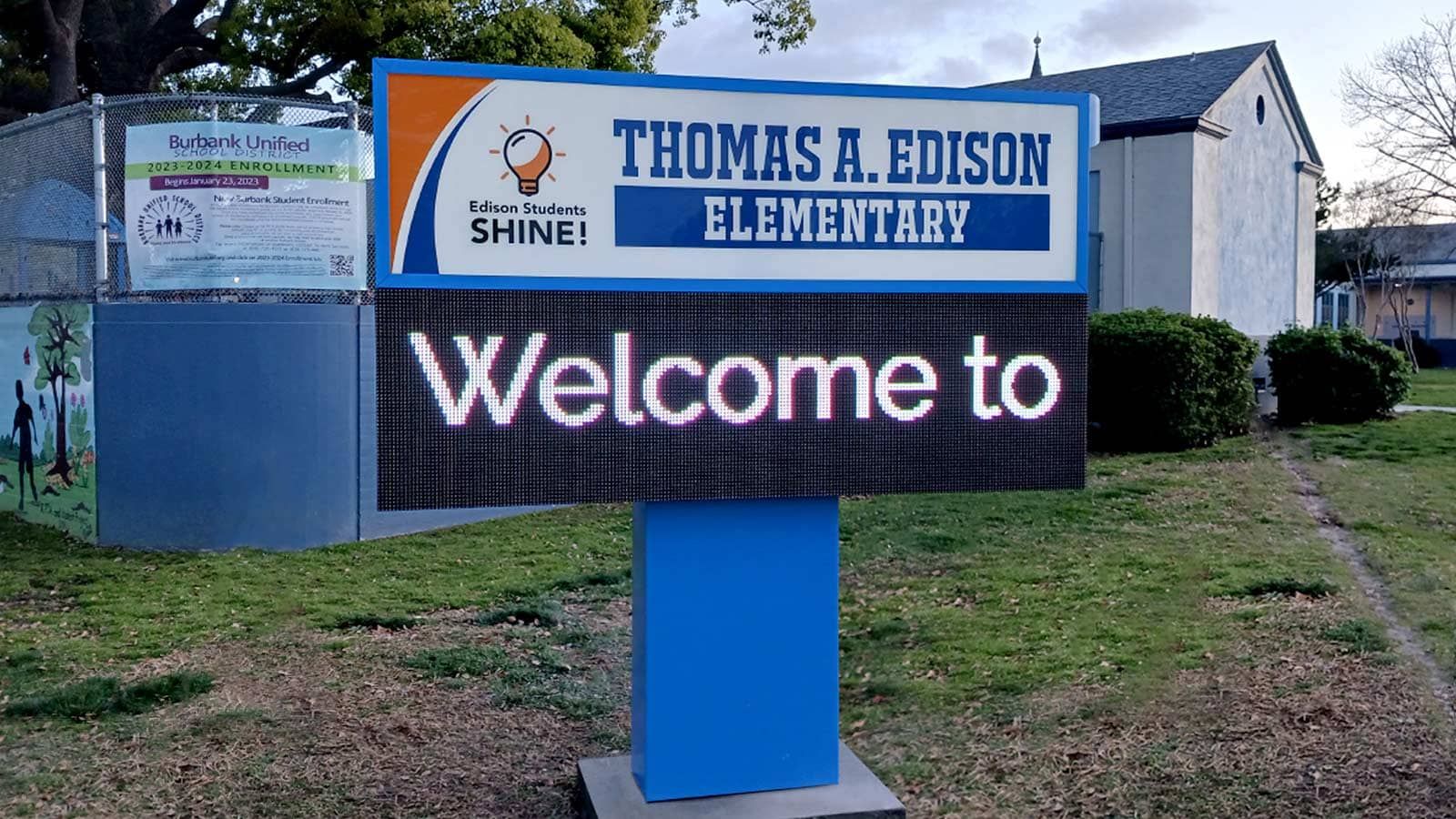 School monument sign installation by the road