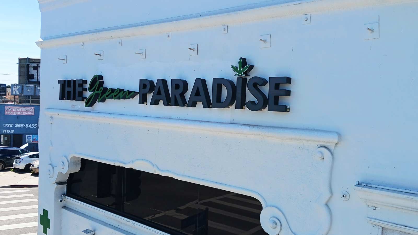 The Green Paradise channel letters mounted on the building