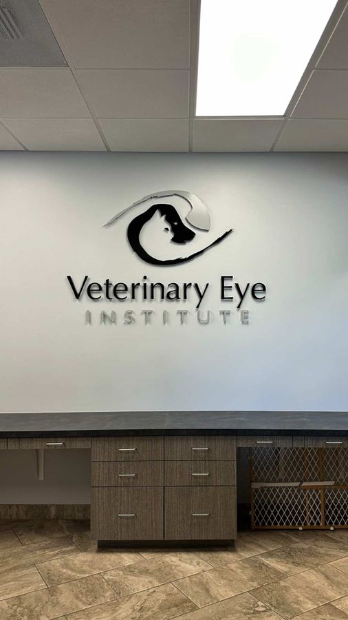 Veterinary Eye Institute logo sign fixed to the wall