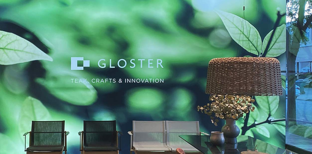 Gloster led backlit wall art portraying the brand name and slogan along with a nature scene
