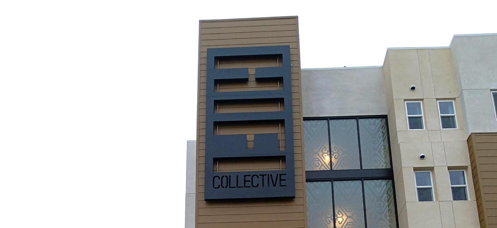 HIF Collective neighborhood signage in a wall-mount style made of aluminum and lexan