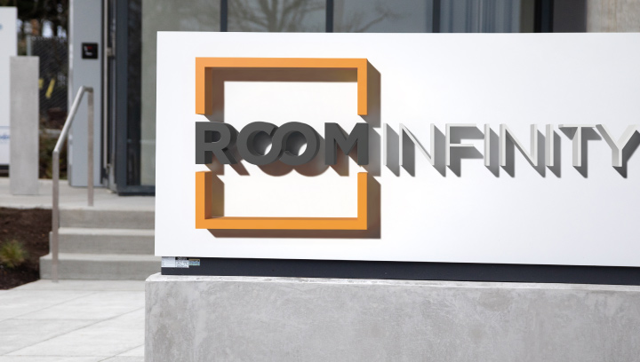 Room Infinity condominium sign spelling the community name for the entrance design