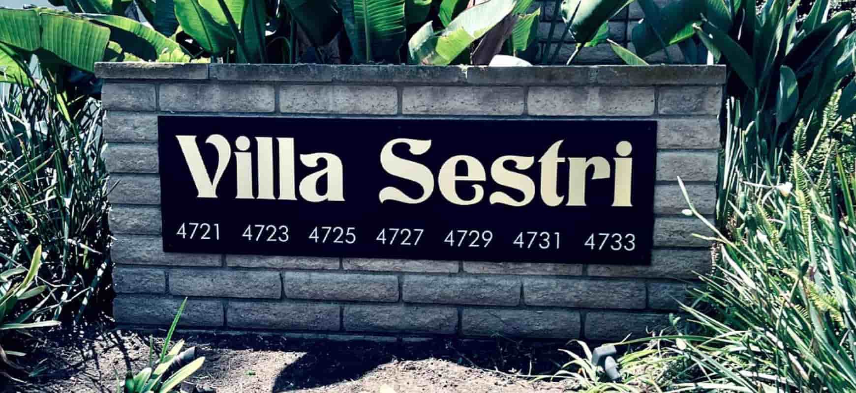Villa Sestri condominium sign in a freestanding style made of acrylic and brushed aluminum