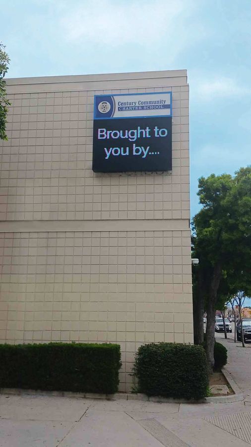 Eye-catching building sign installation on the facade
