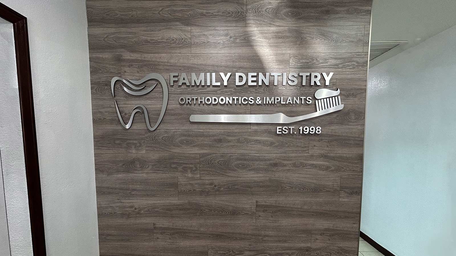 Family Dentistry medical office sign decorating the wall