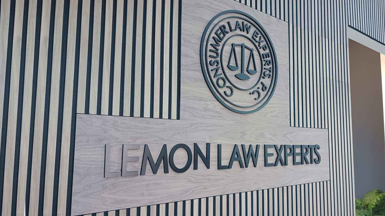 Lemon Law Experts office sign attached to the wall