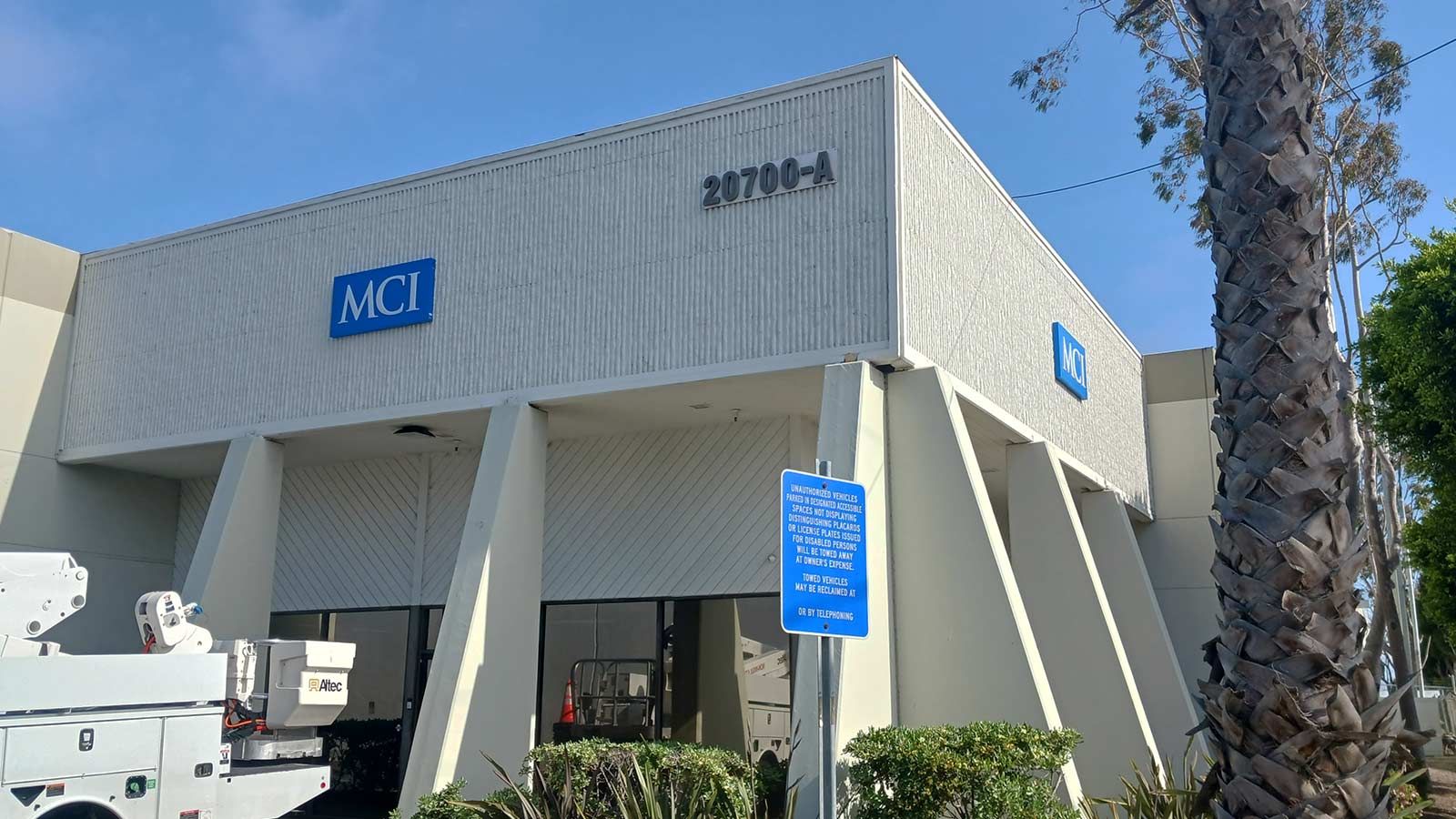 MCI Coach push through sign decorating the facade