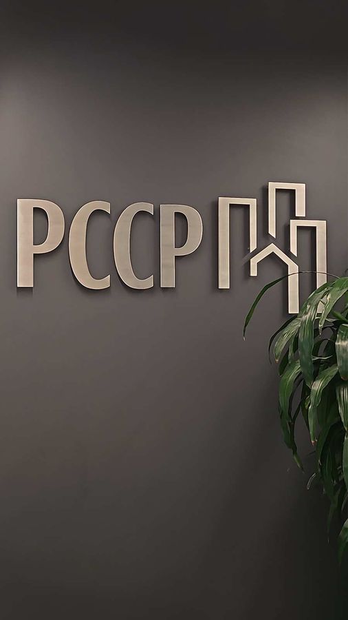 PCCP LLC lobby sign attached to the wall