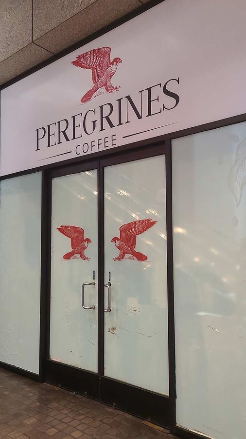 Peregrines Coffee restaurant signs applied to a storefront