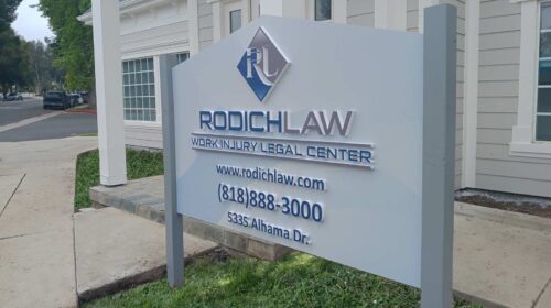 Rodich Law outdoor sign installed by the roadside