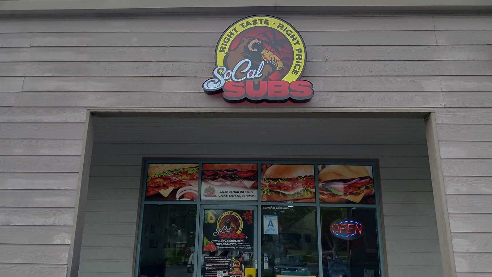 SoCal Subs light box sign installed at the storefront