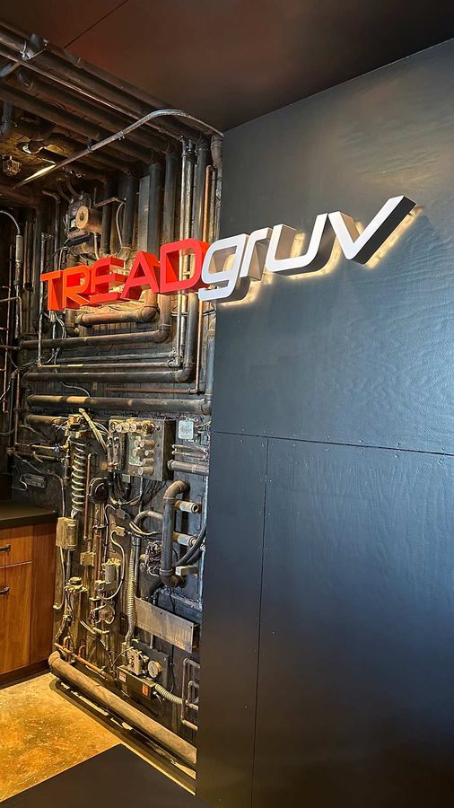 TREADgruv reverse channel letters attached to the wall
