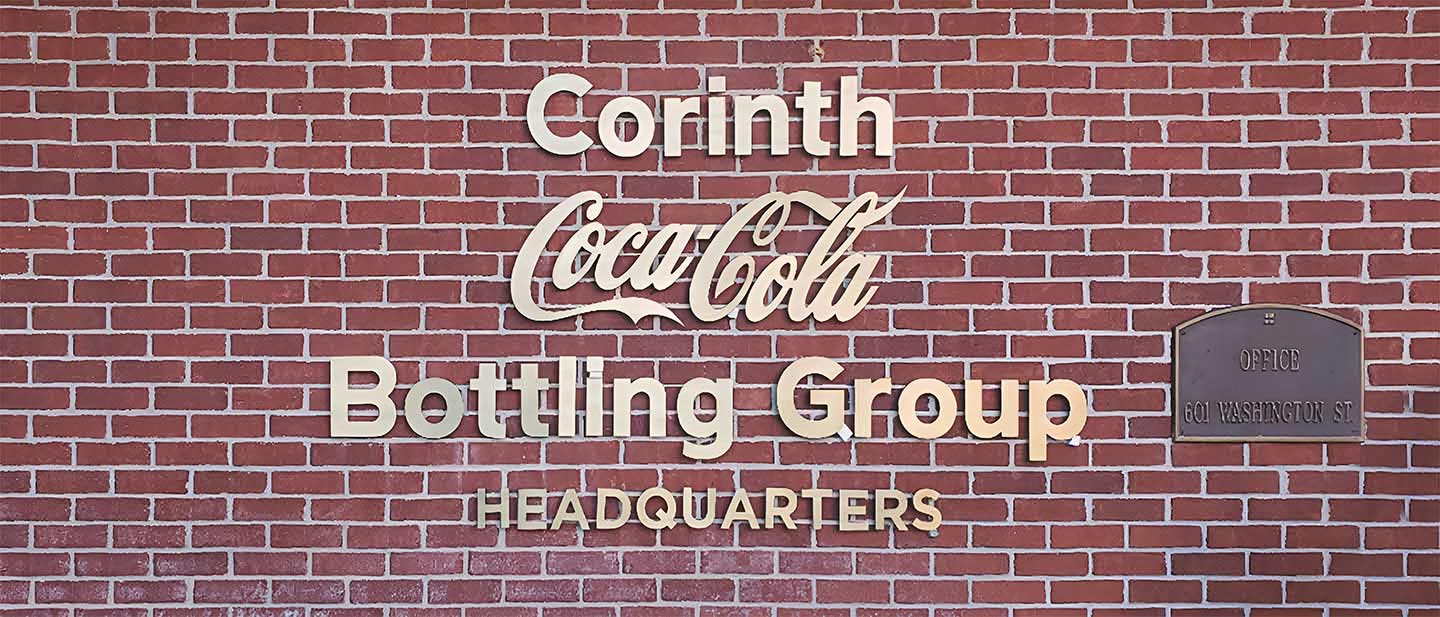 Coca Cola company building sign created and installed by Front Signs sign maker