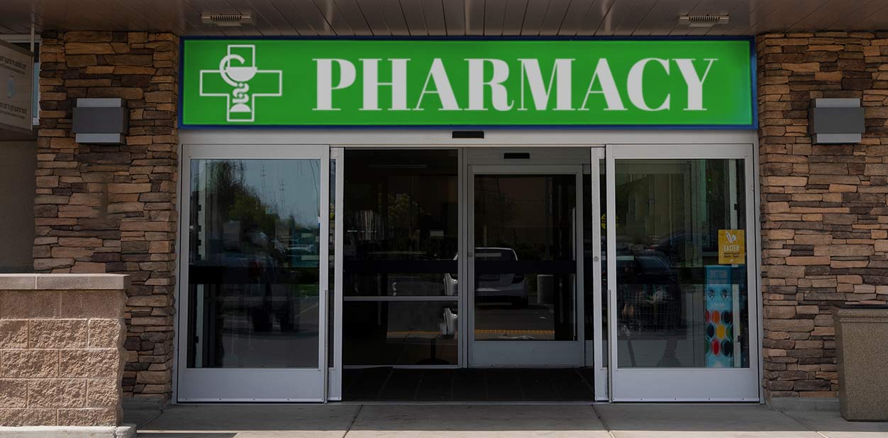 Old pharmacy exterior design with glass entrance doors