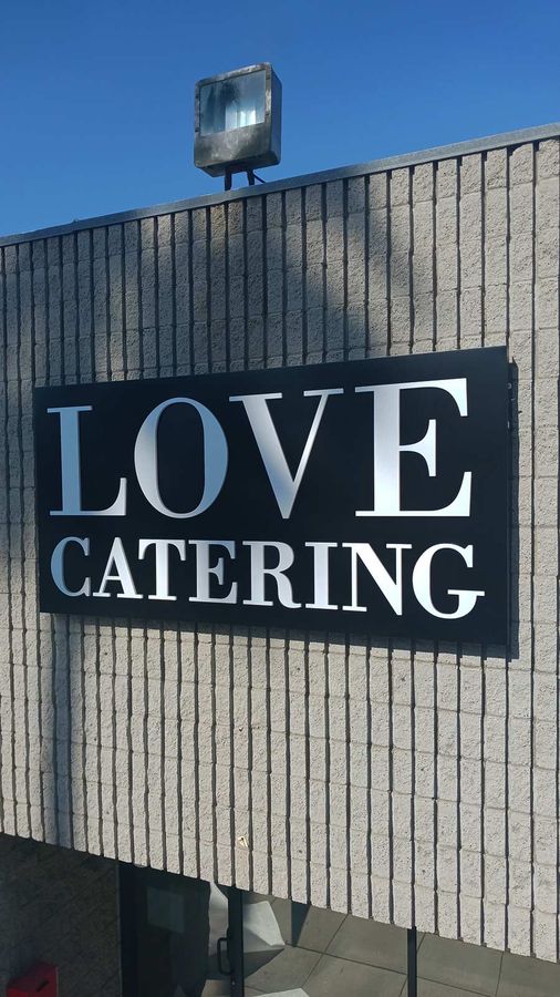 Love Catering, Inc. building sign fixed to the top
