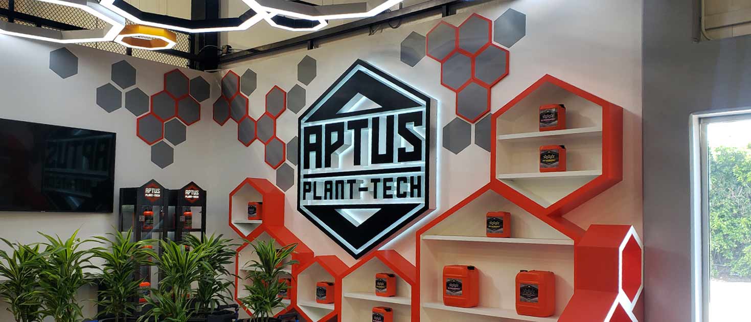 Aptus Plant-Tech wall signage with illuminated hexagonal pieces made of acrylic and aluminum