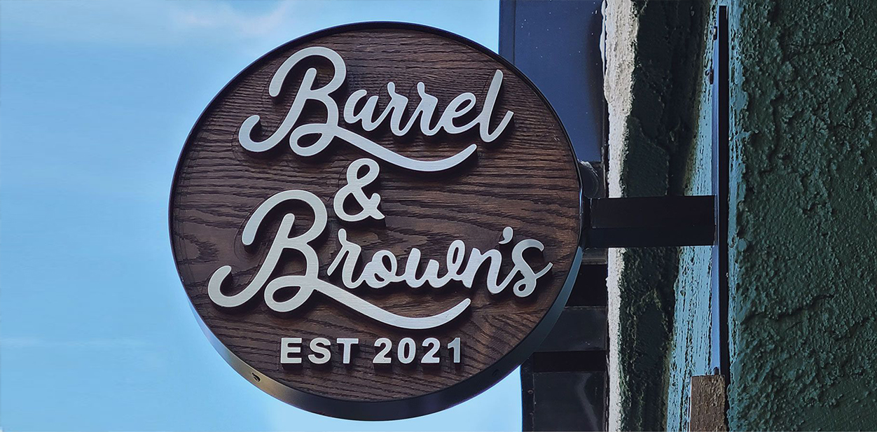 Barrel & Brown's modern retail store signage design with a wall-blade mounting