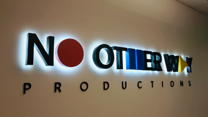No Other Way Productions wall signage displaying the brand logo made of aluminum and acrylic