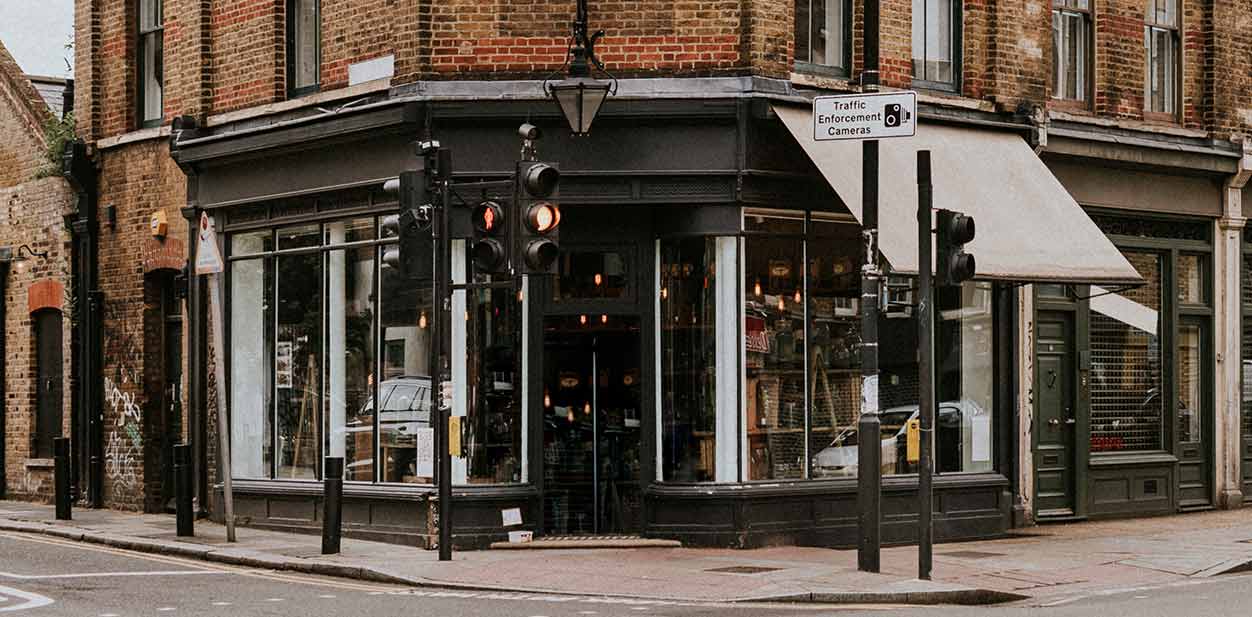 Retro retail store exterior design with glass and wooden entrance doors