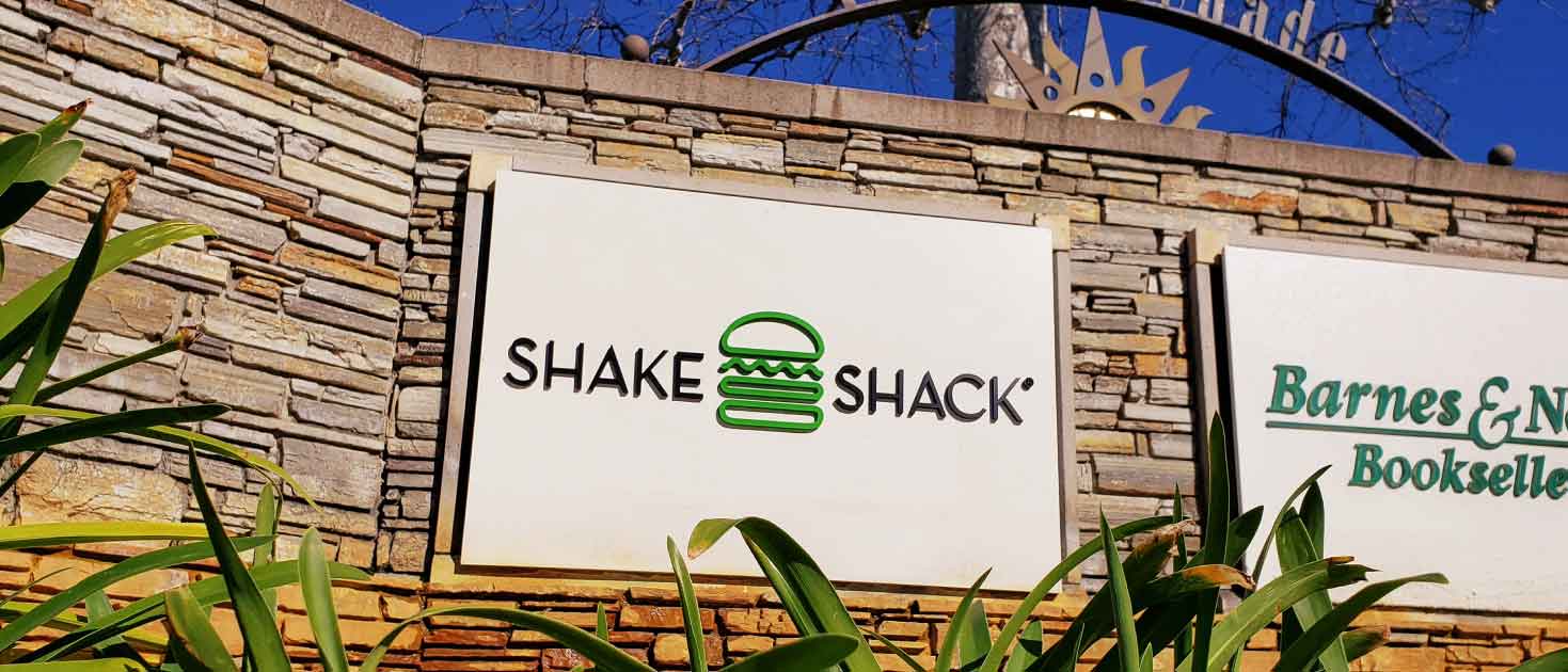 Shake Shack wall signage displayed in exterior settings and made of acrylic material