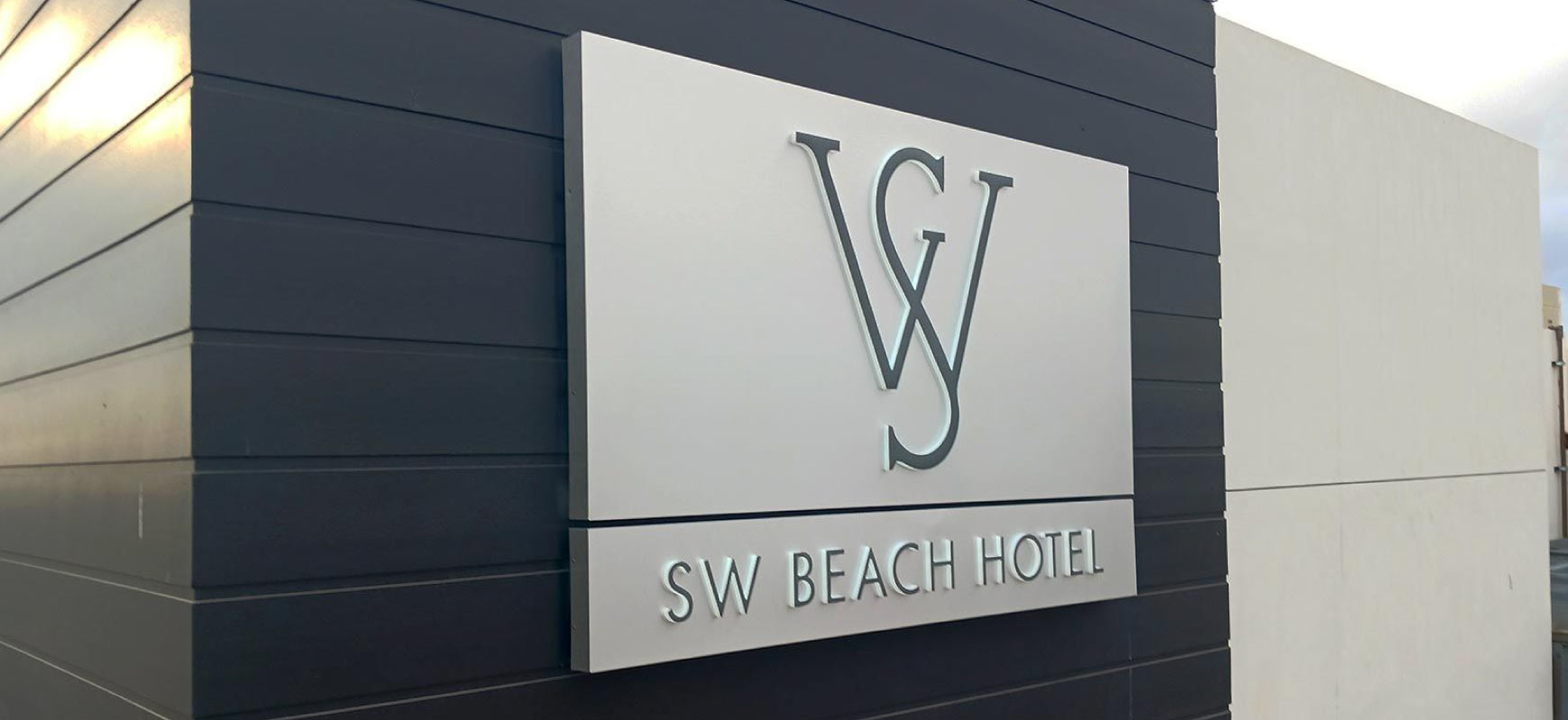 SW Beach Hotel wall signage with the brand name and logo made of aluminum and lexan