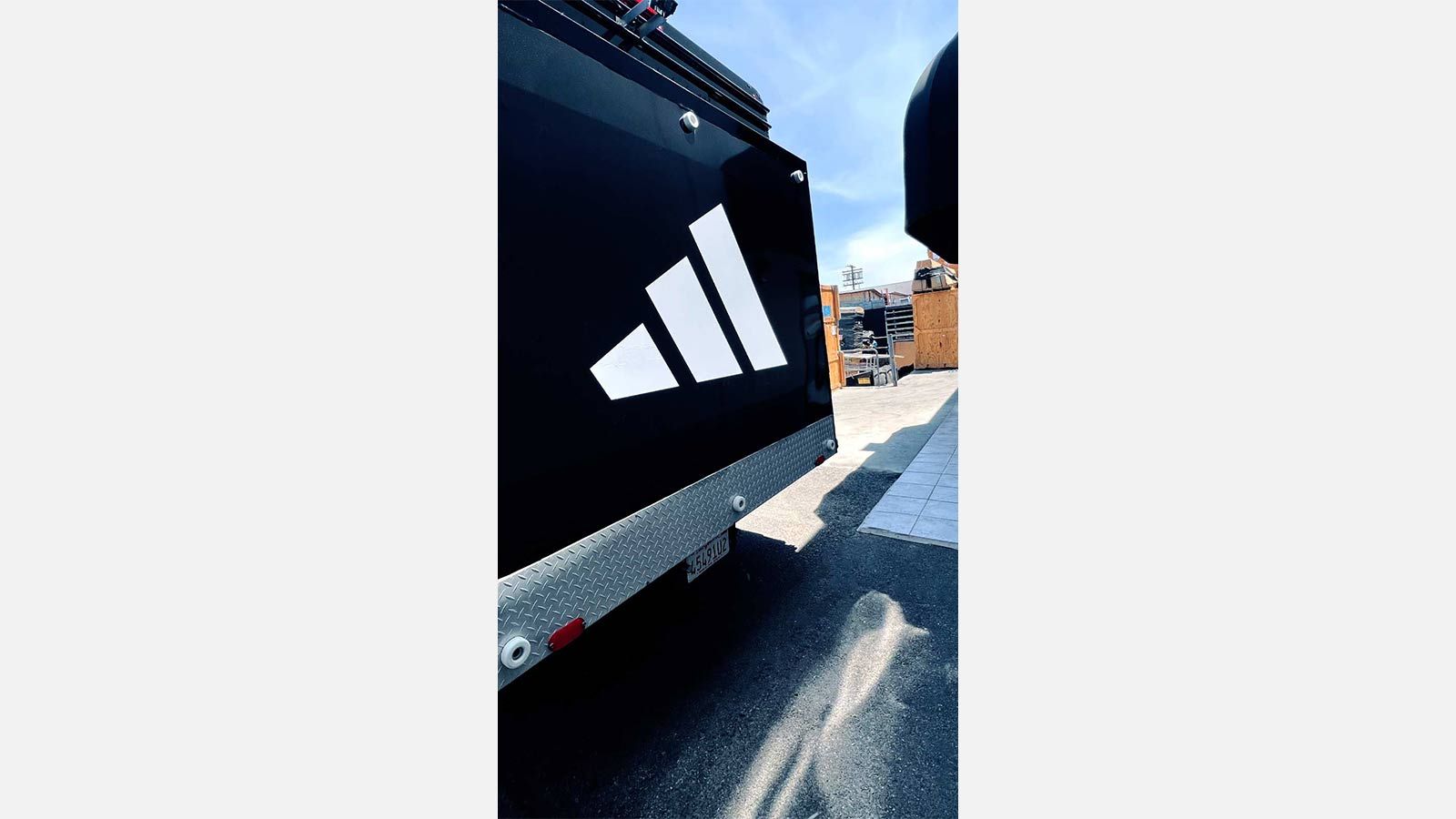Adidas car wrap attached to the back of a truck