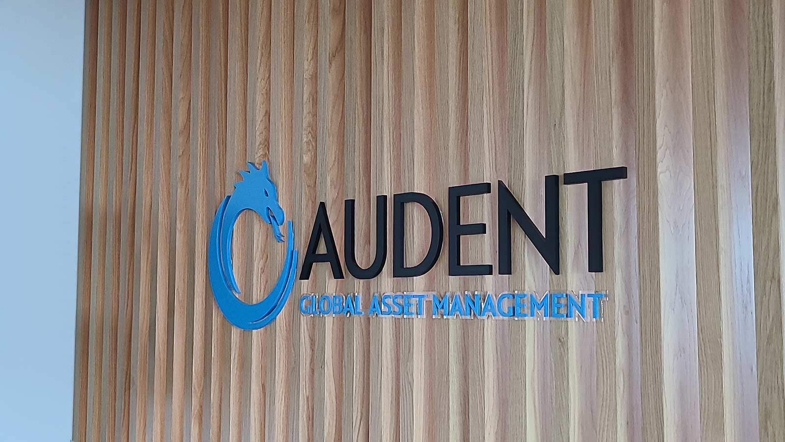 Audent Global Asset Management acrylic sign on a wall