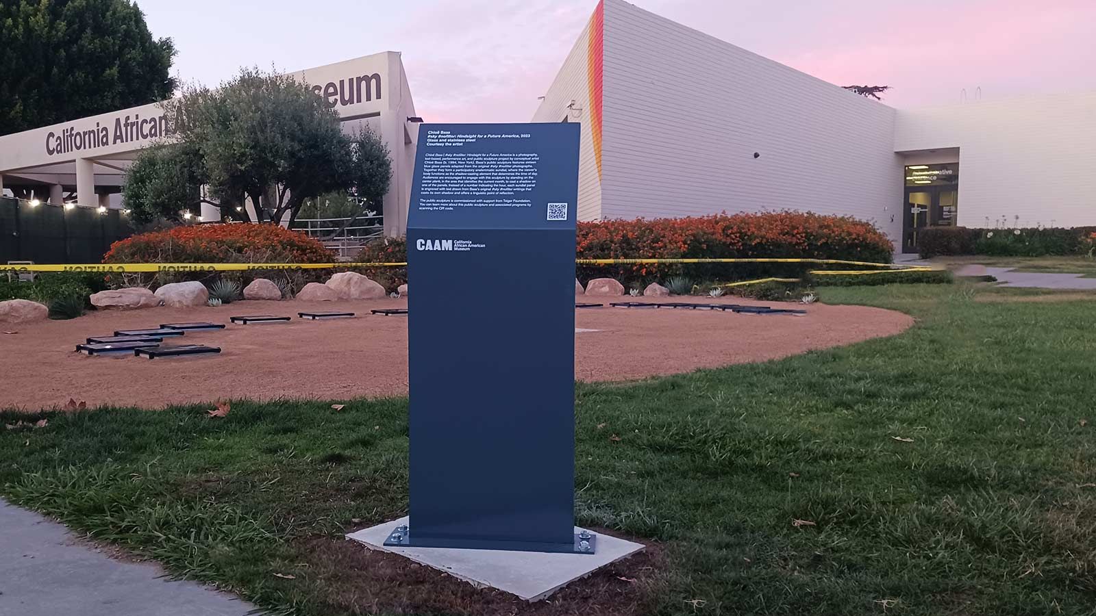 California African American Museum aluminum sign in a park
