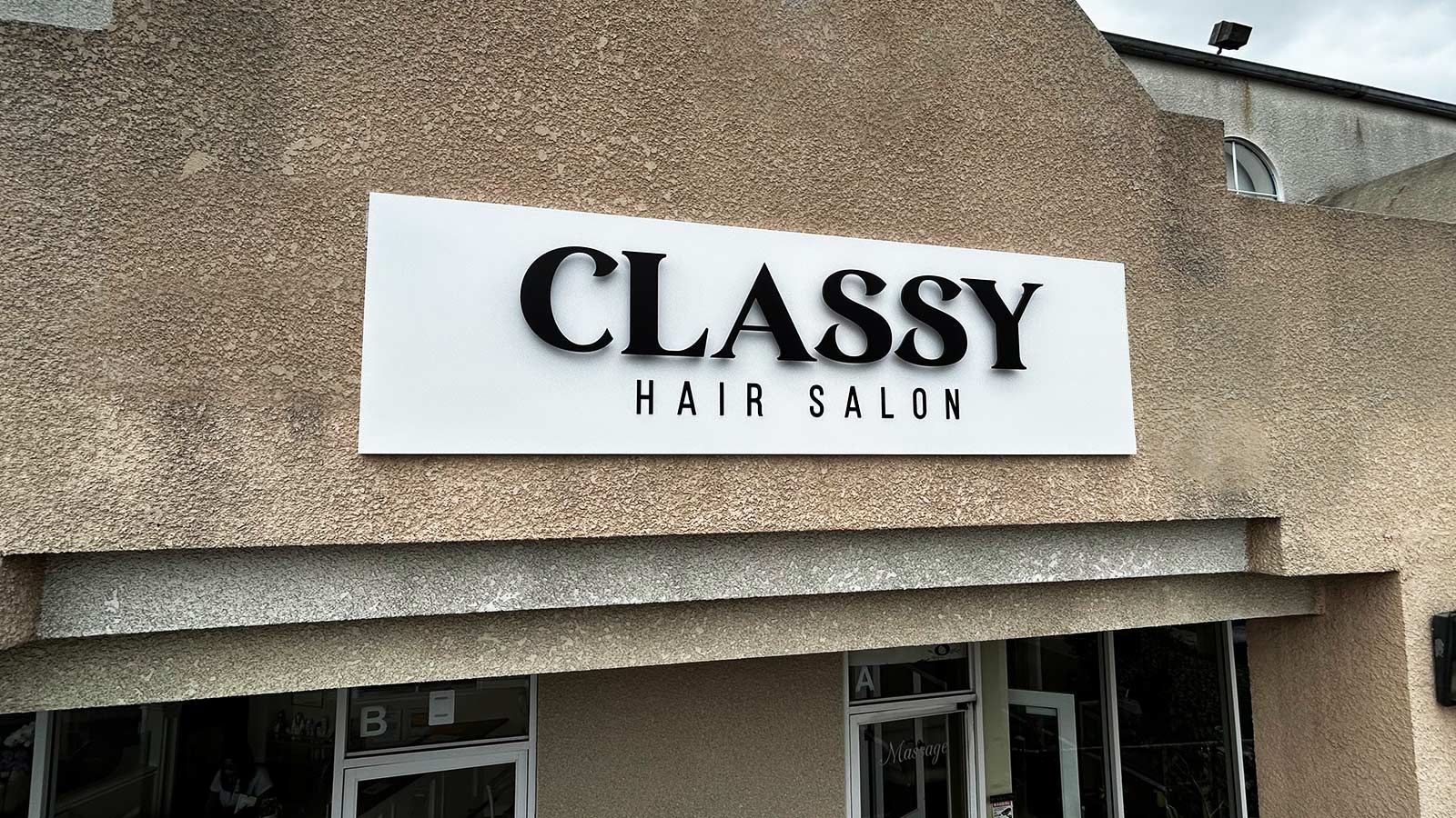 Classy Hair Salon modern sign mounted on the facade