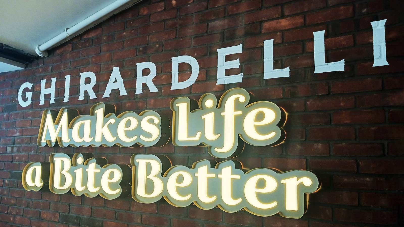Ghirardelli push through sign set up on the wall