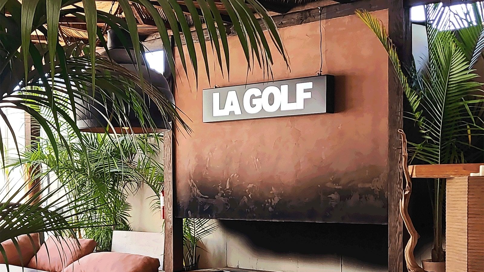 LA Golf light box sign mounted on the wall