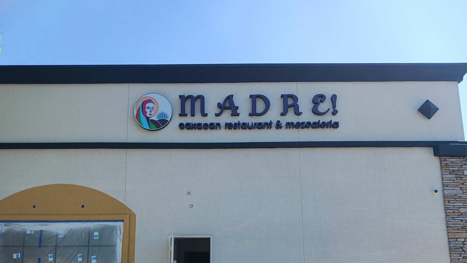 Madre channel letters mounted on the building