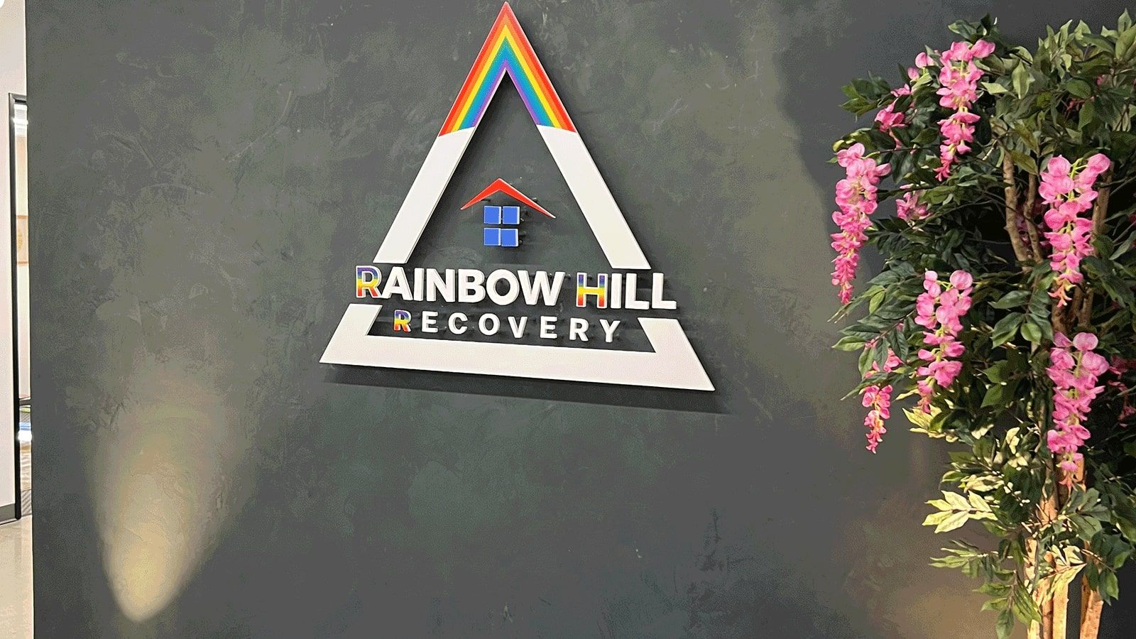 Rainbow Hill Recovery 3D sign installed on the wall
