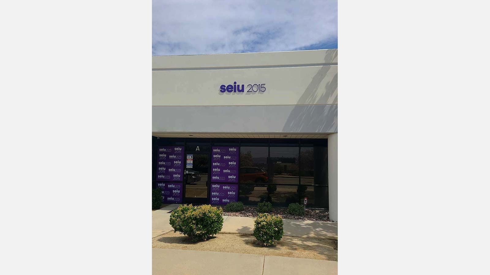 SEIU 2015 PVC sign attached to the facade