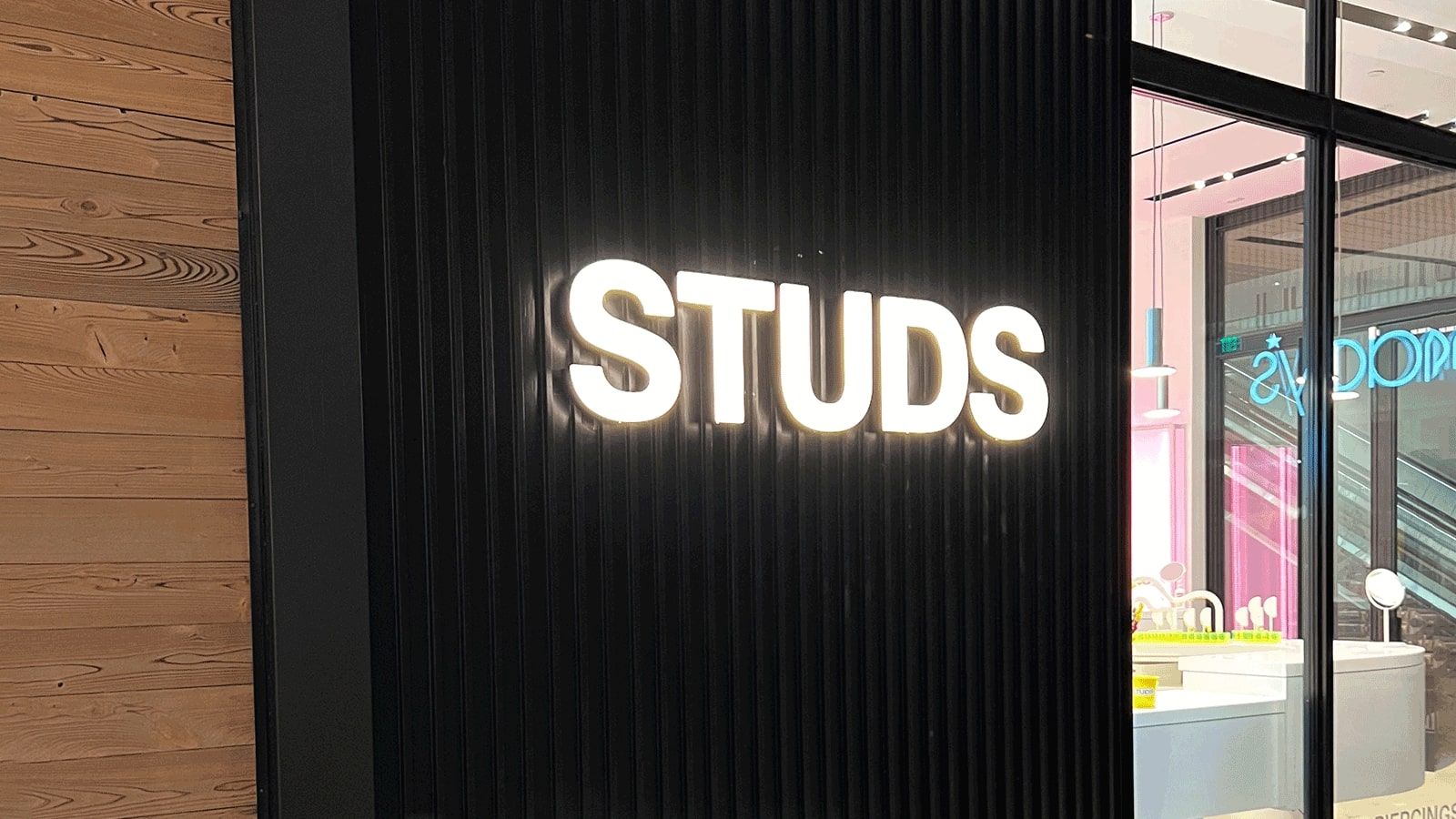 STUDS store sign installed on the wall